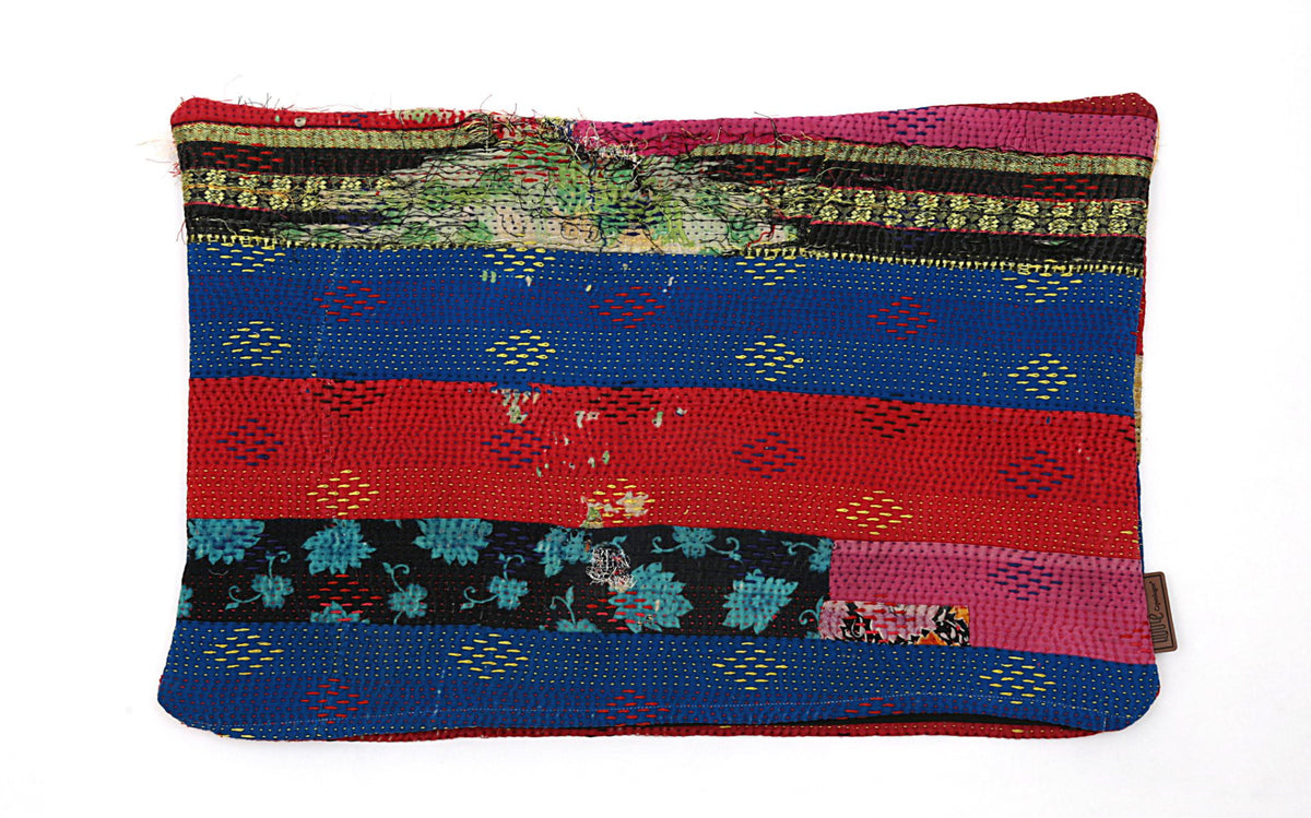 The cushion cover features vibrant colors with red, blue and black stripes, adorned with floral and diamond patterns. Choose the cushion for its unique and handmade look that adds character to any room. Size: 60 x 40 cm.