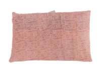 Sari pillowcase 60x40 in blue turquoise checkered/horizontal striped pattern with beige and cream gray background on sofa.